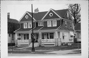 2515-2517 WASHINGTON AVE, a Dutch Colonial Revival duplex, built in Racine, Wisconsin in 1910.