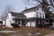 407 S ADAMS ST, a Greek Revival house, built in Lancaster, Wisconsin in 1866.