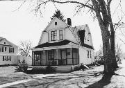 326 W 2ND ST, a Dutch Colonial Revival house, built in New Richmond, Wisconsin in 1900.