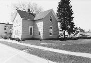 137 E 3RD ST, a Cross Gabled small office building, built in New Richmond, Wisconsin in 1883.