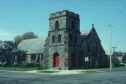 NW CNR OF 6TH AVE AND CLERMONT ST, a Late Gothic Revival church, built in Antigo, Wisconsin in 1908.
