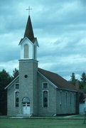 COUNTY HIGHWAY B/E ON SE SIDE OF HAYWARD, HISTORYLAND, OLD HAYWARD, a Front Gabled church, built in Hayward, Wisconsin in 1897.
