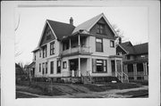 2409-2411 N 1ST, a Queen Anne duplex, built in Milwaukee, Wisconsin in 1892.