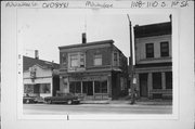 1108-1110 S 1ST ST, a Queen Anne retail building, built in Milwaukee, Wisconsin in 1894.