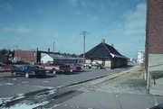 BETWEEN STATE & BROADWAY BY RR TRACKS, a Craftsman depot, built in Medford, Wisconsin in 1913.