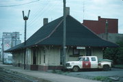 BETWEEN STATE & BROADWAY BY RR TRACKS, a Craftsman depot, built in Medford, Wisconsin in 1913.