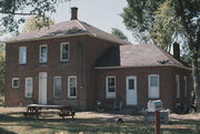 W SIDE OF OLD US HIGHWAY 63 .5 MI N OF BARRON CO LINE, a Two Story Cube house, built in Barronett, Wisconsin in 1900.