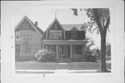 1457 N 38TH ST, a Dutch Colonial Revival house, built in Milwaukee, Wisconsin in 1904.