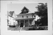 3026-3028 N BOOTH, a Queen Anne duplex/two-flat, built in Milwaukee, Wisconsin in 1899.