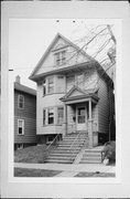 1027 E HAMILTON, a Queen Anne duplex, built in Milwaukee, Wisconsin in 1902.