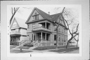 2100-2102 N NEWHALL, a Colonial Revival/Georgian Revival duplex, built in Milwaukee, Wisconsin in 1897.