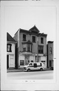 2213-15 N TEUTONIA AVE, a Queen Anne retail building, built in Milwaukee, Wisconsin in 1883.