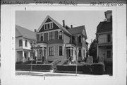 1910-1912 N WARREN AVE, a Queen Anne duplex, built in Milwaukee, Wisconsin in 1893.