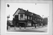 7707 W STATE ST & 7700 HARWOOD AVE, a English Revival Styles small retail building, built in Wauwatosa, Wisconsin in 1924.