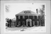 7715 W Wisconsin Ave, a Colonial Revival/Georgian Revival house, built in Wauwatosa, Wisconsin in 1926.