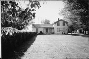 SOUTH SIDE OF E DELAVAN DR, JUST WEST OF 11-14, a Greek Revival house, built in La Prairie, Wisconsin in 1850.