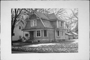 1243 DEWEY AVE, a Dutch Colonial Revival house, built in Beloit, Wisconsin in 1890.