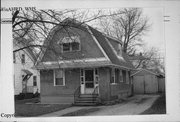 1768 HEMLOCK ST, a Dutch Colonial Revival house, built in Beloit, Wisconsin in 1917.