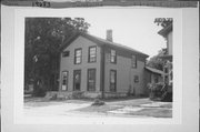 212-14 S LOCUST ST, a Greek Revival house, built in Janesville, Wisconsin in 1855.