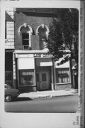 15 N MAIN ST, a Italianate retail building, built in Janesville, Wisconsin in 1865.