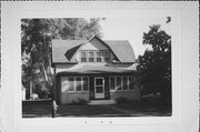 327 E LAKE AVE, a Dutch Colonial Revival house, built in Ladysmith, Wisconsin in 1905.