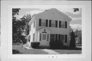 919 OAK ST, a Greek Revival house, built in Baraboo, Wisconsin in 1860.
