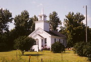 COUNTY HIGHWAY J, N SIDE, AT INTERS W/ COUNTY HIGHWAY W, a Greek Revival church, built in Kinnickinnic, Wisconsin in 1868.
