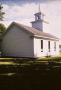 COUNTY HIGHWAY J, N SIDE, AT INTERS W/ COUNTY HIGHWAY W, a Greek Revival church, built in Kinnickinnic, Wisconsin in 1868.