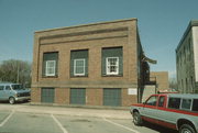 145 W 2ND ST, a Commercial Vernacular small office building, built in New Richmond, Wisconsin in 1913.