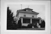 311 N GREEN AVE, a American Foursquare house, built in New Richmond, Wisconsin in 1916.