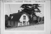 19922 HARRIS ST (106 HARRIS ST), a Dutch Colonial Revival house, built in Galesville, Wisconsin in 1920.
