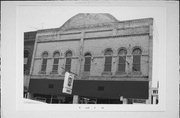 39 S WISCONSIN ST, a Romanesque Revival retail building, built in Elkhorn, Wisconsin in 1892.