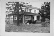 406 MAXWELL ST, a Dutch Colonial Revival house, built in Lake Geneva, Wisconsin in 1930.