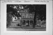 243 N MARTIN ST, a Second Empire house, built in Sharon, Wisconsin in 1875.