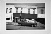 136-138 W CENTER ST, a Commercial Vernacular retail building, built in Whitewater, Wisconsin in 1874.