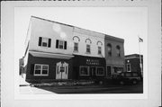 201-205 W CENTER ST, a Commercial Vernacular retail building, built in Whitewater, Wisconsin in 1874.