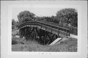 S OF CNR OF E MAIN ST AND FONDA ST, a NA (unknown or not a building) wood bridge, built in Whitewater, Wisconsin in 1880.