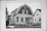 230 S 7TH AVE, a Dutch Colonial Revival house, built in West Bend, Wisconsin in 1912.