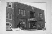 308 - 310 N Main St, a Commercial Vernacular large retail building, built in West Bend, Wisconsin in 1916.