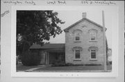 224 E WASHINGTON ST, a Greek Revival house, built in West Bend, Wisconsin in 1879.