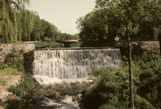 ON MENOMONEE RIVER NEAR MAIN ST AND WATER ST INTERSECTION, a NA (unknown or not a building) dam/lock, built in Menomonee Falls, Wisconsin in 1954.