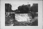 ON MENOMONEE RIVER NEAR MAIN ST AND WATER ST INTERSECTION, a NA (unknown or not a building) dam/lock, built in Menomonee Falls, Wisconsin in 1954.