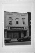 132 N MAIN ST, a Commercial Vernacular small retail building, built in Oconomowoc, Wisconsin in 1879.