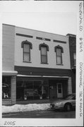 132 N MAIN ST, a Commercial Vernacular small retail building, built in Oconomowoc, Wisconsin in 1879.