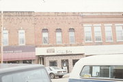 209 N MAIN ST, a Commercial Vernacular small retail building, built in Waupaca, Wisconsin in 1896.