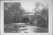 MAIN ST OVER THE CRYSTAL RIVER, a NA (unknown or not a building) stone arch bridge, built in Dayton, Wisconsin in 1900.