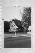 13-19 N MAIN ST, a Late Gothic Revival house, built in Clintonville, Wisconsin in 1915.
