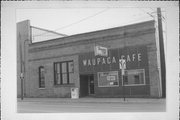 107 W FULTON ST, a Commercial Vernacular warehouse, built in Waupaca, Wisconsin in 1878.