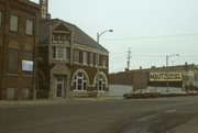 225 W WISCONSIN AVE, a Romanesque Revival small office building, built in Neenah, Wisconsin in 1893.