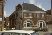 225 W WISCONSIN AVE, a Romanesque Revival small office building, built in Neenah, Wisconsin in 1893.